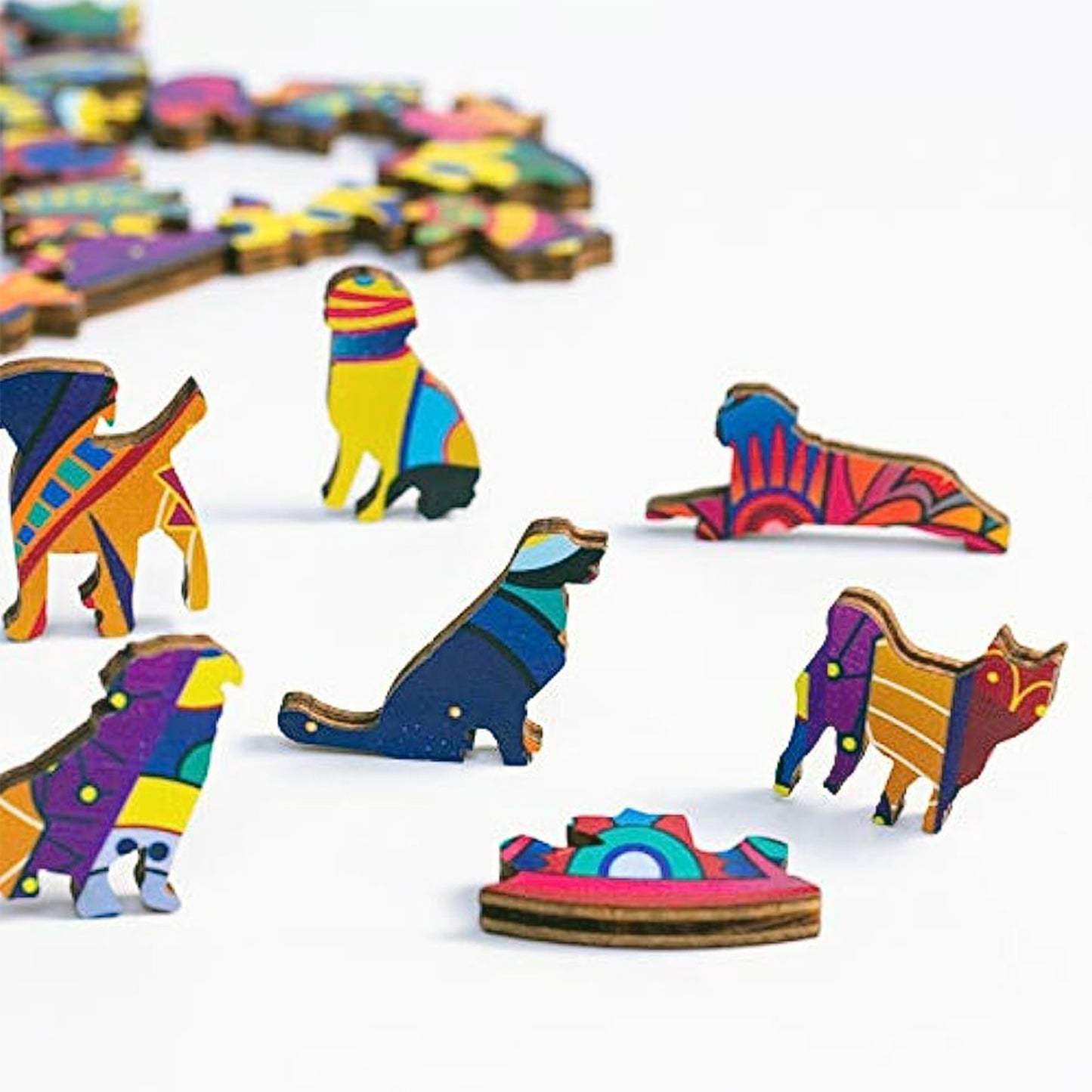 Close-up display of the unique animal-shaped wooden puzzle pieces included in the cat artisan set.
