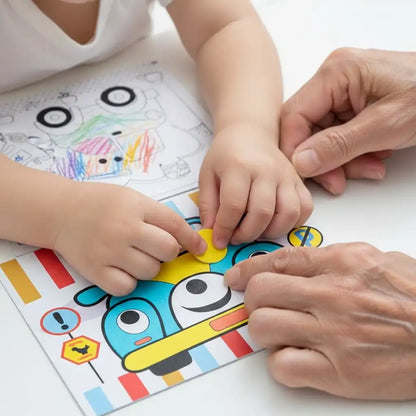 Close-up of a child's hands peeling and sticking pieces for the 3D foam puzzle game.
