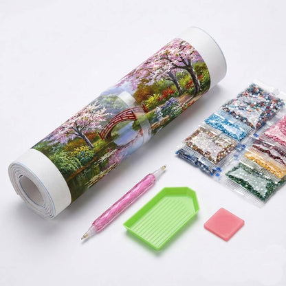 Complete 5D diamond painting kit including canvas roll, colorful gems, pen, and tray.