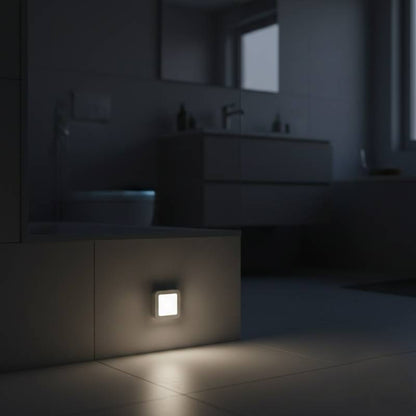 Motion sensor light placed near the floor to provide safe navigation in the bathroom at night.