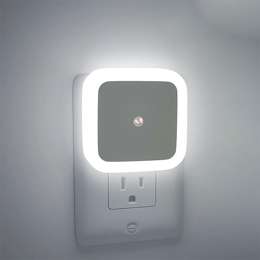 Square night light with illuminated border on a gray wall