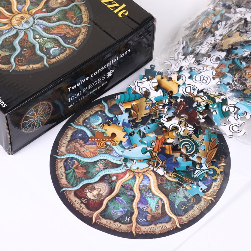 The retail packaging box for the Celestial Wonders 1,000-piece puzzle shown alongside its assorted puzzle pieces.