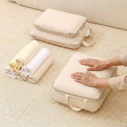 demonstration of rolling clothes and using compression packing cubes to save space in luggage
