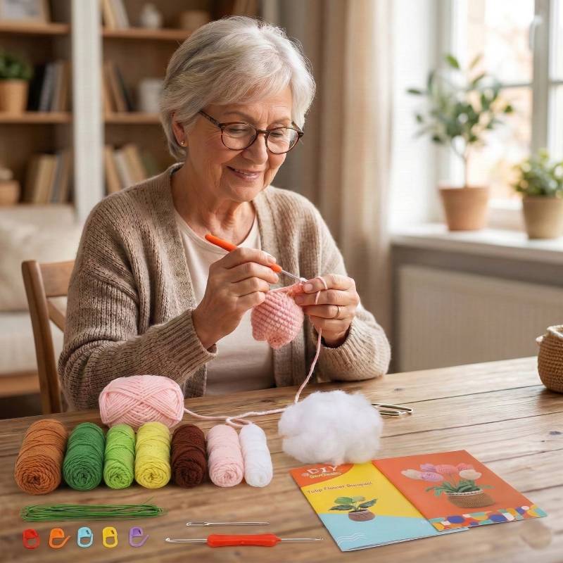 senior woman smiling while crocheting a pink tulip using a beginner-friendly crochet kit