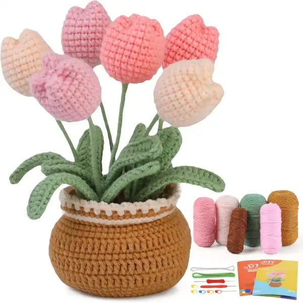 crochet flower kit for tulips showing colorful yarn rolls and finished hand-stitched plant