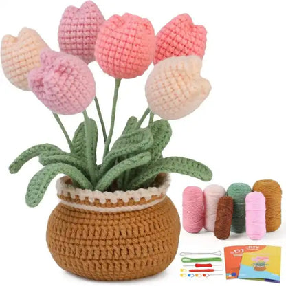 crochet flower kit for tulips showing colorful yarn rolls and finished hand-stitched plant