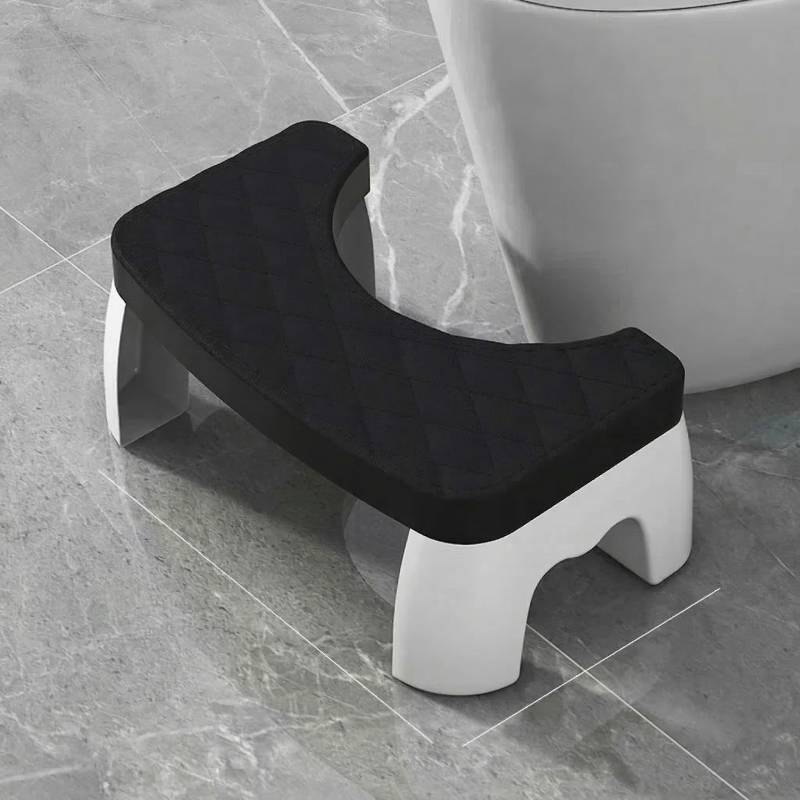 black bathroom safety step stool designed to fit around the base of a standard toilet bowl