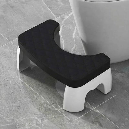 black bathroom safety step stool designed to fit around the base of a standard toilet bowl