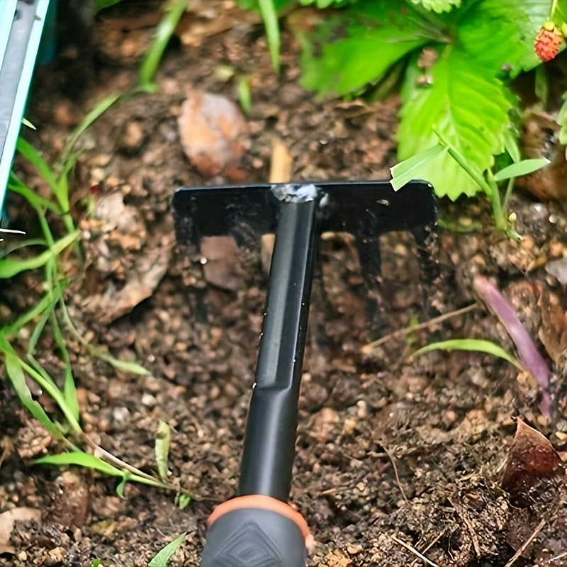 ergonomic hand rake breaking up soil in vegetable garden