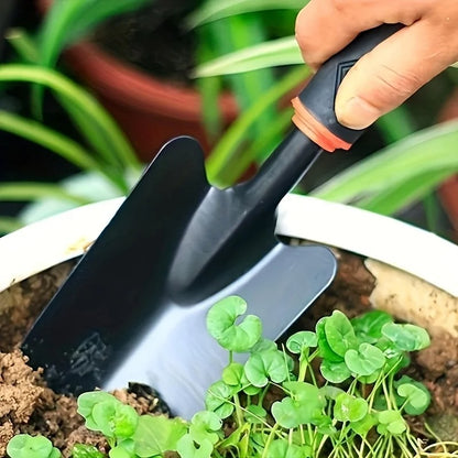ergonomic garden trowel digging soil for planting seedlings in garden bed