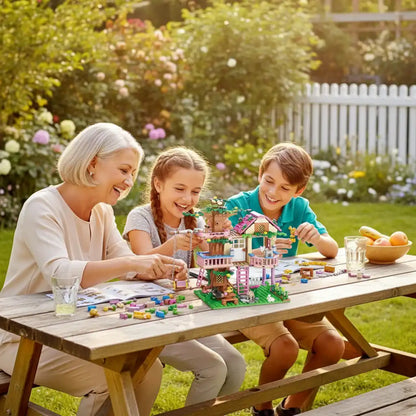 Seniors and kids playing with the Friends City Tree House building blocks set in a sunny garden.