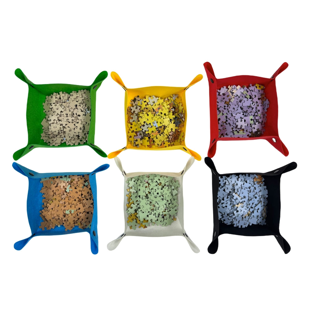 square sorting trays in various colors filled with jigsaw puzzle pieces for easy color-coded assembly