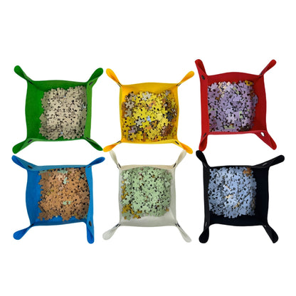 square sorting trays in various colors filled with jigsaw puzzle pieces for easy color-coded assembly