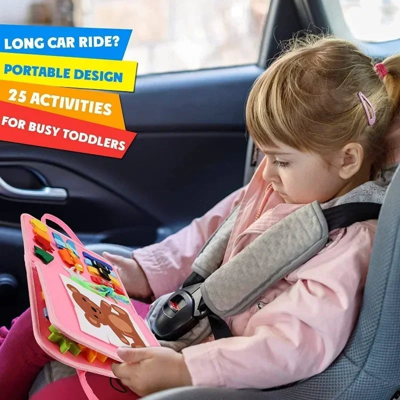 Toddler using the portable Montessori busy board quiet book during a long car ride.