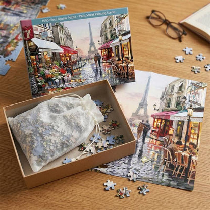 Packaging box and puzzle pieces of the premium 1000-piece Paris street jigsaw puzzle.