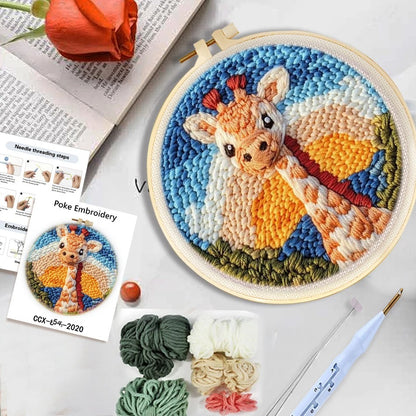 punch needle embroidery set for beginners including yarn, fabric with giraffe pattern, and punch tool