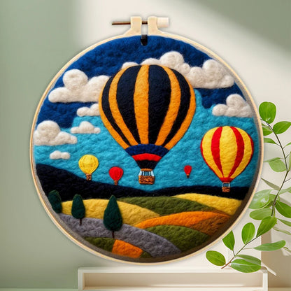 The Sunrise Balloon variant of the scenic needle felting kit displayed as finished wall art.