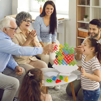 senior grandparents enjoying a fun stacking game session with their grandchildren and parents