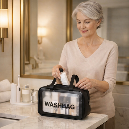 senior woman organizing toiletries in a clear waterproof travel pouch bag at a bathroom vanity