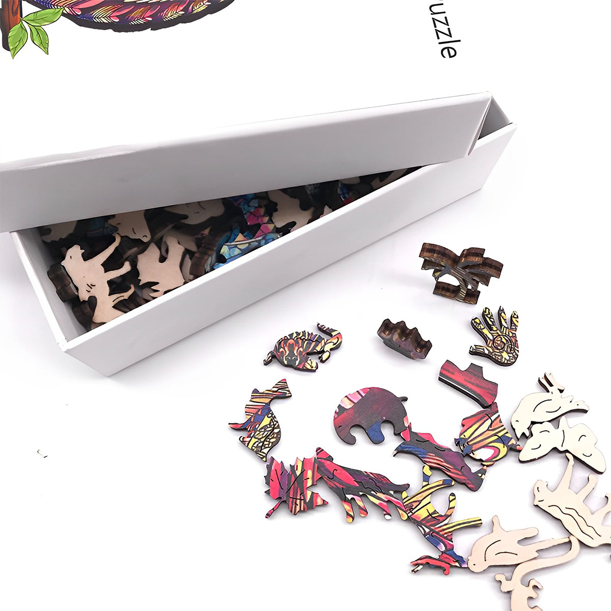 The artisan wooden cat puzzle pieces displayed with their clean white storage box packaging.
